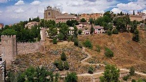 Aerial view of Toledo. Historical medieval building with Monasterio de San Juan de los Reyes and San Martin's Bridge. Spain. Europe