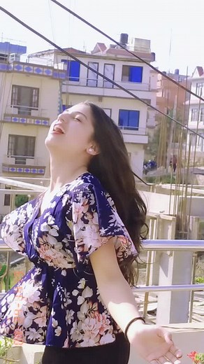 Stylish Balcony Performance in Floral Dress