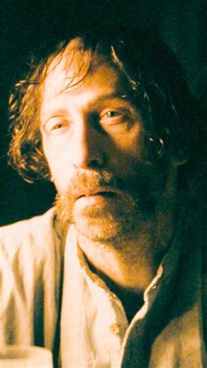 Billy is sitting right across from him.