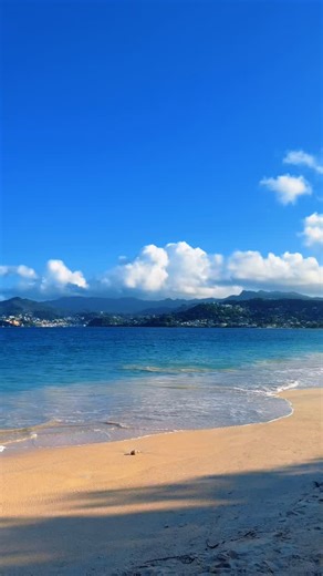 BREAKING: WINTER UPDATE (GRENADA EDITION) TODAY (THU, JAN 22, 2026) ☀️ Sunny 🌡️ 88°F / 31°C 🌙 74°F / 23°C SKIES: Bright, clean, postcard-blue. SUN: Warm on your shoulders, the kind that slows time. WATER: Crystal-clear turquoise, shimmering like glass. You can see the sand beneath your feet and watch the light dance under the surface. WAVES: Soft, steady, and gentle. BREEZE: Salt-kissed and calming, like nature’s air-conditioning. VISIBILITY: 100% — perfect for long swims, slow floats, and “on