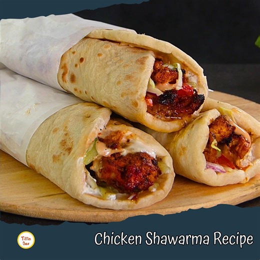 Juicy, smoky, and full of flavor — this Chicken Shawarma tastes just like your favorite street corner wrap! 🌯 Tender chicken, creamy garlic sauce, and soft bread come together for the ultimate bite. #tiffinbox #kidstiffinbox #recipes #banglarecipes #quickrecipes #easyrecipes #snacks #snacksrecipes #streetfood #streetfoodrecipes #shawarma #chickenshawarma #shawarmawrap #shawarmarecipe #garlicsauce #homemadeshawarma #iftarrecipes #ramadanrecipes #bangladeshistreetfood #iftarsnack #homemadesnack #