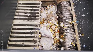 Recycling process of paper and plastic waste at a local facility in the morning hours