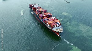 Aerial side view of cargo ship carrying container and running for export cargo yard port to custom ocean concept technology transportation , customs clearance, webinar banner forwarder mast