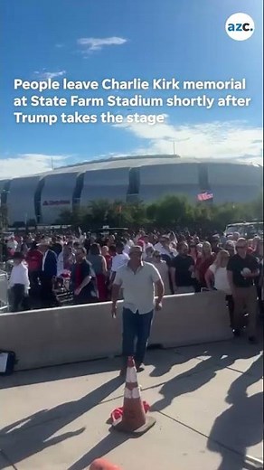 People exit State Farm Stadium shortly after Trump takes stage during Charlie Kirk memorial