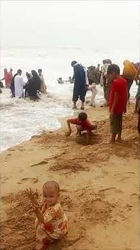 Cute Baby Playing in the Sand at the Beach