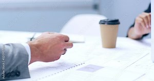 Architect engineers planning and designing a building blueprint together in a collaboration meeting. Professional designers drawing development structures for new construction team projects