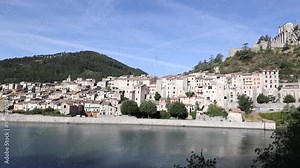 France, Sisteron commune with its ancient stone houses and natural green and rocky surrounding