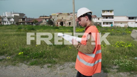 Building Engineer Writing Notes While Working Outdoor | Premium Stock Video Footage