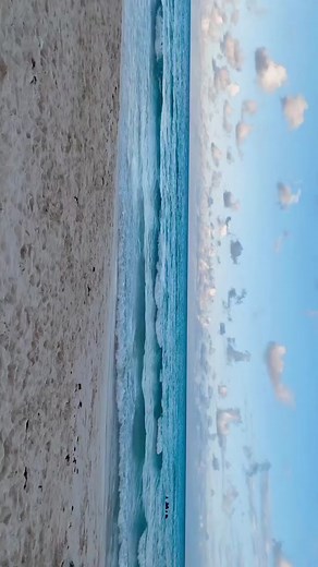 Serene Ocean Waves and Sandy Beach in Cancun