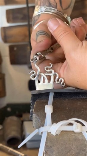 MODERN ARCHITECT on Instagram: "From table to treasure. 🍴✨ Witness the ultimate design transformation as everyday flatware is meticulously reshaped into wearable art. It’s not just a bracelet, it’s a testament to creative ingenuity. Form finds new purpose. Created by @notsoflatware 🗜️🛠️ #Creative #Upcycled #Art #Bracelet #ModernArchitect #NewEngland"