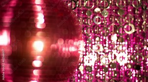 funky pink mirror ball spinning with patterns of light