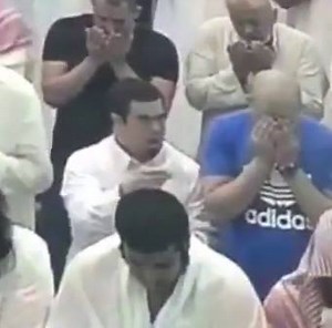 This is so beautiful. A young man with Down Syndrome offers tissue to a crying man in prayer. | Brotherly