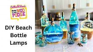 DIY Beach Bottle Lamps! This is such a fun summer craft idea where you can upcycle old glass into something fresh and new. Handmade Happy Hour with Cathie Filian is teaching how to tint Mod Podge and paint a beach scene on bottles! 🌊 💛 Learn more about Mod Podge at plaidonline.com/mod-podge 🎨 Watch more Make It With Mod Podge: bit.ly/MakeItWithModPodge 💌 Sign up for our newsletter! plaidonline.com/email-signup #ModPodge #GlassPainting #SummerCrafts | Plaid Crafts