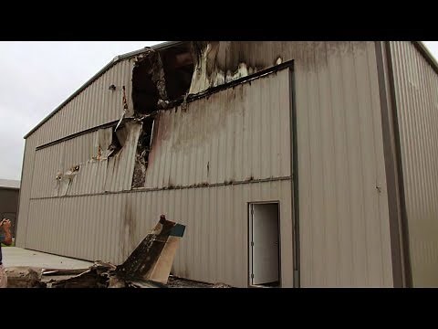Beechcraft Bonanza Crashes Into Hangar After Narrowly Avoiding Runway Collision