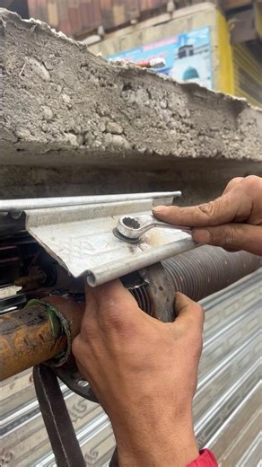Shutter rolling spring fitting #fabrication #shortsfeed #shutterspiingfitting #shorts #umerwelder