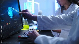 Doctors examining brain image on computer, disease diagnostics and treatment