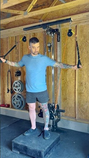 Cable flies on the Titan Fitness wall mounted pulley tower