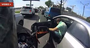 Lane Splitting Biker Crashes on an Open Door | Carscoops