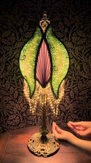 [sold!] New one-of-one lampshade in the shop! 🍐🍇✨ This one features hand-beaded glass fringe. Extremely time consuming but the effect is so worth it. I forgot to record the airbrushing step unfortunately but the green silk is airbrushed around the edges for some depth. In my shop now along with a few other shades! #lamptok #lampshade #handmade #maximalism #maximalistdecor #victorian #victorianhouse #artdeco #artnouveau #