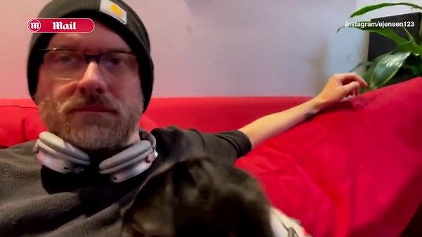 'The Walking Dead' actor Erik Jensen lounges on the couch with his dog Althea