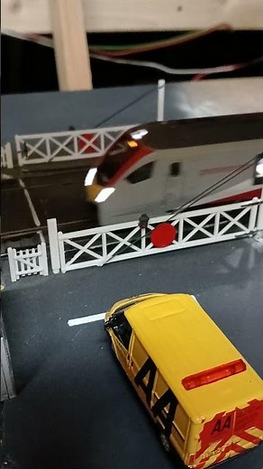 Hornby class 755 327 Greater Anglia passing a level crossing