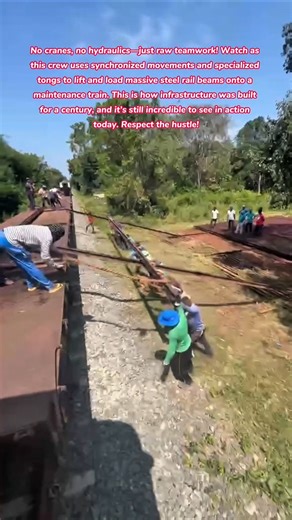 Old School Strength! 👷‍♂️🛤️ Loading Rail Steel by Hand #teamwork #train #railway #human #strength