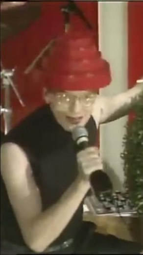 Devo performs "Whip It" live as the musical guest on the cult classic comedy show Fridays.