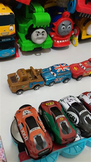 cute yellow thomas train pushing red cars mcqueen and brown tow mater car in pit, Pixar Cars