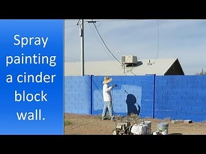 Spray painting cinder block walls step by step.