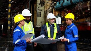 Railway engineer inspects diesel engine Report on the progress of engine parts in the factory. with safety standards