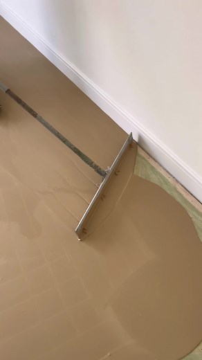 Floor Renovation Process with Metal Scraper Tool