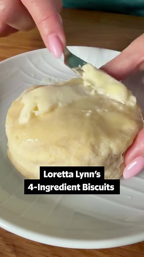 Texas-approved, four-ingredients, AND the recipe comes from the queen Loretta Lynn herself? ❤️🙌 We'll be making these biscuits again and again. Tap the link in bio or keep reading for full recipe details! ⬇️😉 Ingredients: 2 cups self-rising flour 6 tablespoons shortening, cold 3/4 cup buttermilk, cold 4 tablespoons butter, plus extra for topping Directions: Preheat oven to 425 degrees F. Add the flour to a large mixing bowl, then work in the shortening with a fork until the crumbs are coarse a