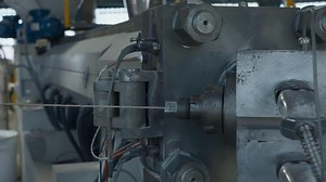 Cable production process, mechanism in a cable factory. Creative. Stretching cable and machinery.