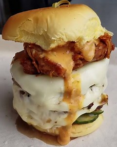 Triple stack burger topped with pulled pork! | FOODbible
