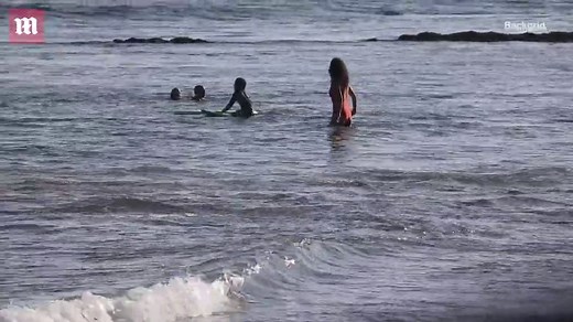 Making a splash! Minnie Driver soaks up sun in red swimsuit