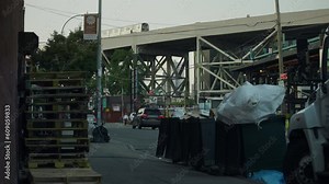 Red Hook Brooklyn, NYC — Garbage Piled On Street Under Elevated Subway Train
