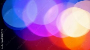 Abstract shine glow background with multicolored light flares and lens effects, reminiscent of a lively night scene.