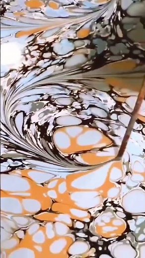 marbling technique transforms liquid colors into flowing art