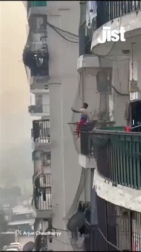 Jist on Instagram: "A viral video from Ghaziabad showed a young boy sitting dangerously on the balcony grill of a high-rise apartment, with his legs dangling outside, sparking widespread concern online. The child was later rescued safely by his family, who said he is autistic and that a brief lapse in supervision led to the incident. The unsettling visuals have reignited discussions around child safety in high-rise buildings, with many urging parents to install child-proof grills and ensure cons