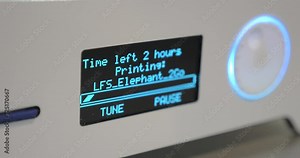 Close-up of display 3D printer while working, showing a progress bar and the time remaining until the end of work on the detail