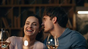 Gentle couple laughing romantic date with wine at home close up. Loving spouses