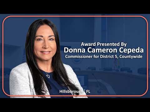 Commissioner Cameron Cepeda presents the American Graphic Design Award from Graphic Design USA.