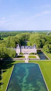 Beautiful medieval castle. Aerial View Shot of Castle. Château de Courances (Domaine de Courances). French castle. drone aerial view with landscaped gardens. Aerial vertical, vertical video background