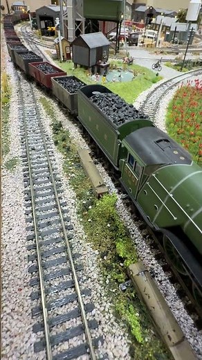 "Cock O The North" pulling weathered coal wagons over a streamlined points crossover.