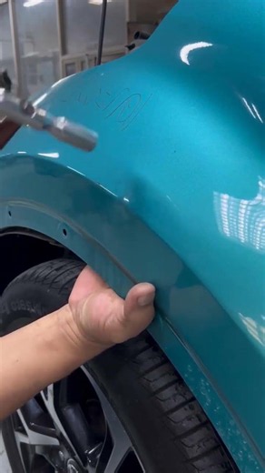 Knock to repair the dent on the front fender.