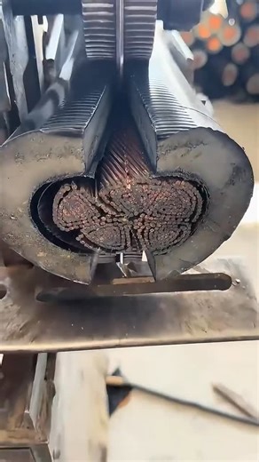 Epic Adhesives on Instagram: "Did you know how thick high-voltage cables are split to recycle the copper inside? ⚡♻️ First, the heavy cable is pushed into a powerful stripping machine. Inside, sharp rotating blades and pressure rollers carefully cut through the tough outer plastic and rubber layers without chopping the metal core. As the cable moves through, the machine peels the jacket open and separates the clean copper strands from the plastic and insulation. The copper falls into one contain