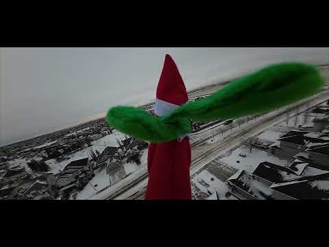 Elf on the shelf flying high.