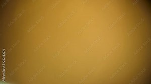 Bright warm soft light overlaying the frame. Light leaks special abstract effect on a dark background.