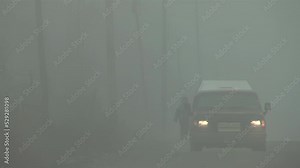 Silhouette of People and Old Pick up Truck on a Rural Road during a Foggy Morning in Varvarco, Neuquen Province, Argentina.