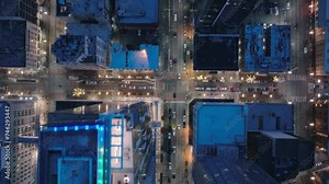 Birds eye overhead view Seattle business district, Washington USA. Top down aerial of tall office and apartment buildings in modern downtown in twilight. Drone shot of city traffic in downtown streets